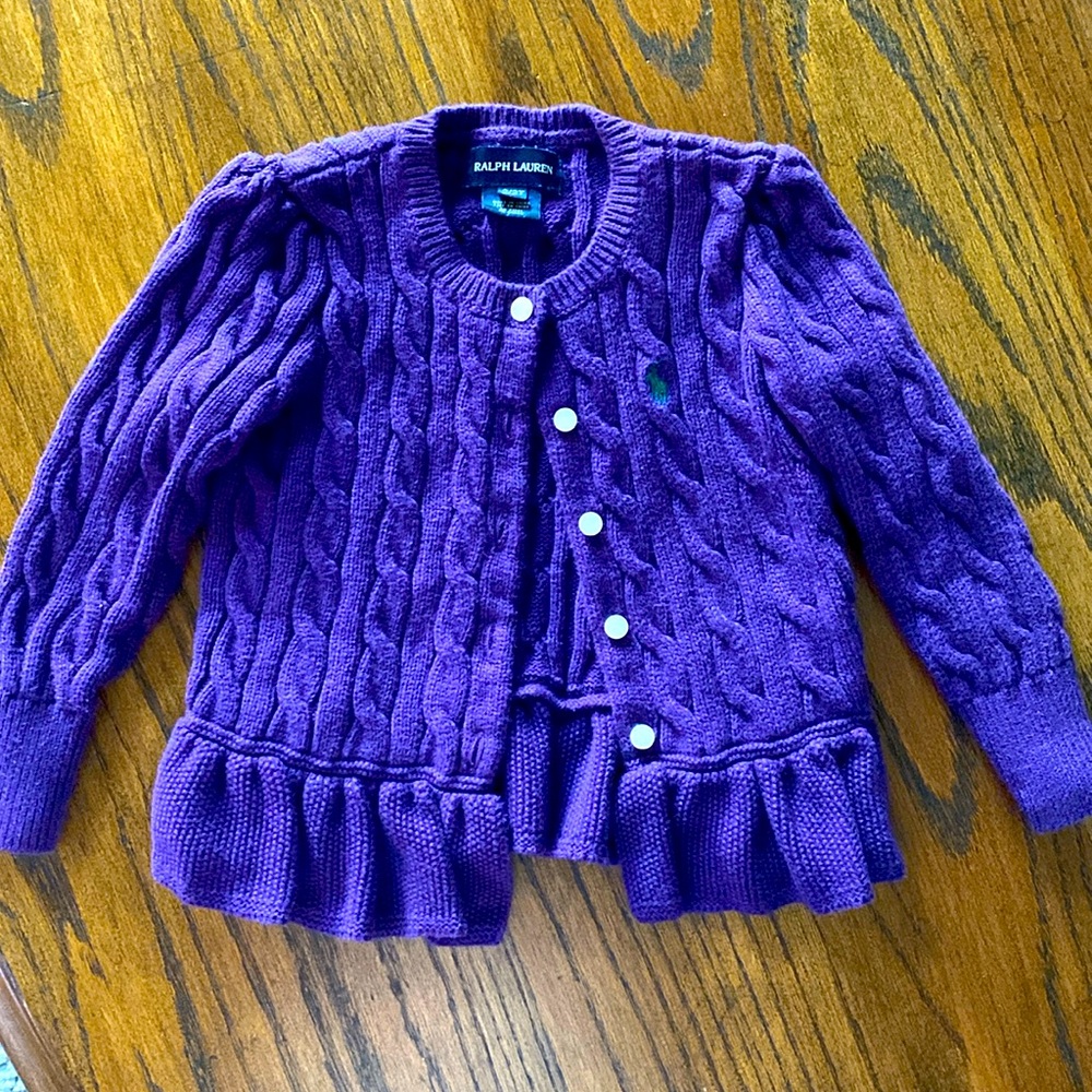 Purple cable knit little girl’s sweater